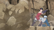 Sarada and Mitsuki stop rocks