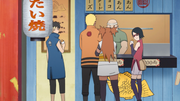 Sarada chooses taiyaki with Naruto, Chōchō, and Kawaki.