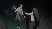Sasuke is stabbed by Madara.