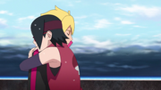 Sarada hugs Boruto after Ikada rescues him.