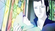 Young Mui holding his infant son, Muku.