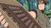 Bandō uses his abacus to figure the costs.