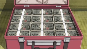 Em forma de cédulas.