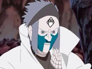 Puppet 6: This puppet had spiky hair and the lower half of its face was green in colour. It had the kanji for "Sangha" (僧, Sō) in its mouth, and worked in conjunction with the Buddha and Dharma puppets to use the Three Jewels Suction Crushing technique.