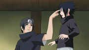 Itachi pokes Sasuke