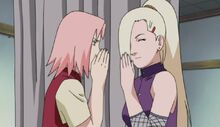 Sakura and Ino whisper about Sai