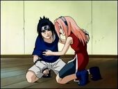 Sakura helps an injuried Sasuke