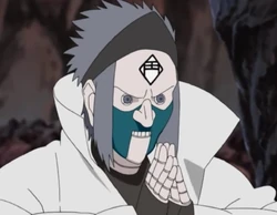 Puppet 6: This puppet had spiky hair and the lower half of its face was green in colour. It had the kanji for "Buddha" (仏, Butsu) in its mouth which activated the Three Jewels Suction Crushing technique when used in conjunction with the Dharma and Sangha puppets.