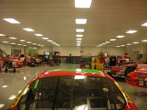 View of the Evernham Motorsports garage for  vehicles.