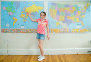 A Walden Elementary pupil shows the other pupils on one of the three giant wall maps where to find Ukraine