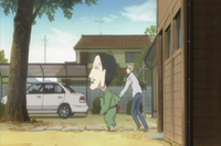 Chobihige grabbing Natsume to help him