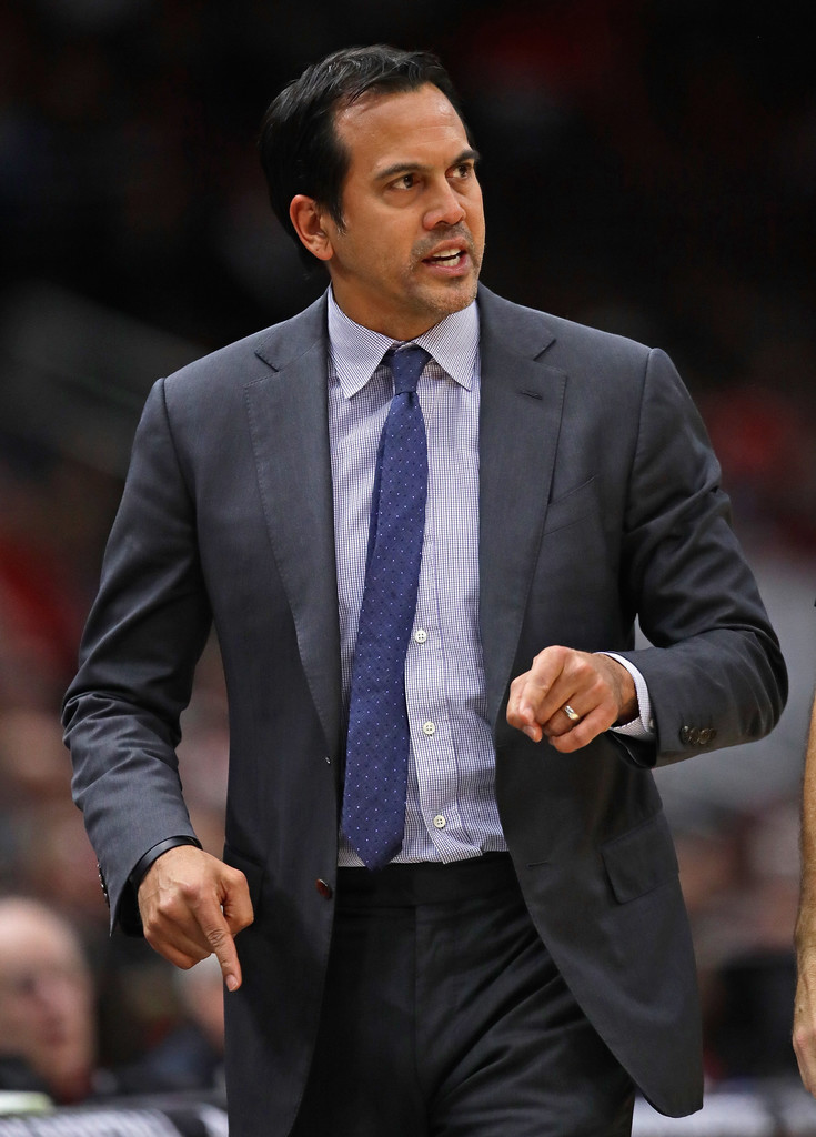 Miami Heat head coach Erik Spoelstra, right, presents a 2011-12