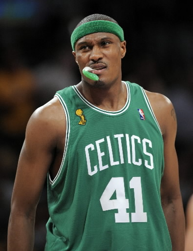 Boston Celtics forward James Posey displays his new Celtics jersey during a  news conference, in Waltham, Mass. on Monday, Aug. 27, 2007, held to  announce his signing. The former 6-foot-8-inch Miami Heat