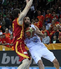 Navarro with Spain's national team attacking the paint against Macedonia's in 2011.
