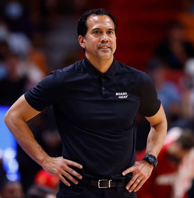 Miami Heat head coach Erik Spoelstra, right, presents a 2011-12