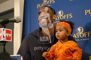 Kobe Bryant laughs with his daughter Natalia while talking to the press