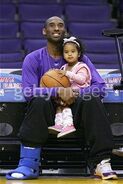 Kobe Bryant holding Natalia Bryant