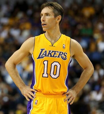 Steve Nash looks on in his Lakers home jersey