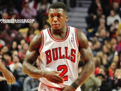 New York Knicks' Nate Robinson, front left, and Chicago Bulls