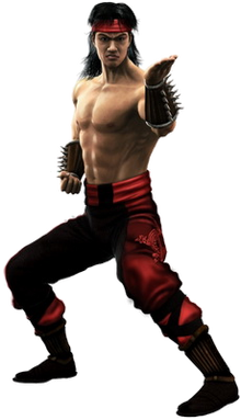 This image shows an Asian male in a fighting stance wearing a red headband, red and black pants, black shoes and no shirt.