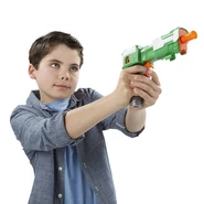 A model aiming the Blast-Tech Lightsaber blaster.
