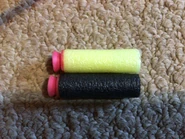 A comparison the Larami and Sharper Image versions of the dart.