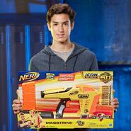 A Nerf model holding the packaging of the Magstrike.