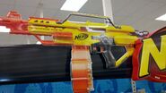 The prototype Stampede ECS-50 with the fifty dart drum, depicted as a sign over the Nerf section of Target stores.