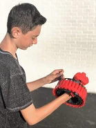 A model loading the Tempest with D-Dart Darts.