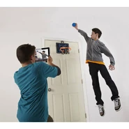 A model taking video of another model about to slam dunk the Cyber Hoop.