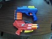 Buzz Bee Jaguar with Nerf Elite darts, shown with Air Zone Rogue for comparison.