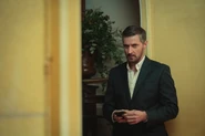 William holds a phone