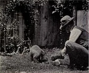 Mr. Eugene S. Bruce and his bear.