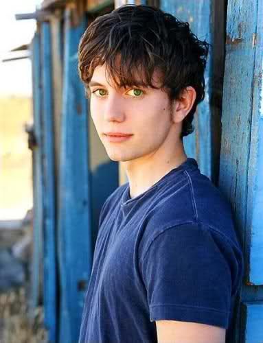 teenage boy with brown hair and green eyes