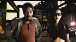 Cross con su compañera (Need for Speed: Most Wanted - Prólogo)