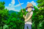 Mio pictures herself fishing in a stream