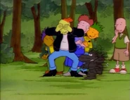 Porkchop, disguised as a Neematoad, spooks Roger and his gang.