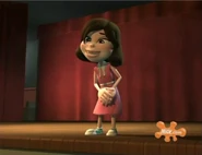 Betty performing on stage posing with her hands on her skirt...