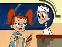 JennyBrad81.jpg (123 KB) Jenny, in her human exo-skeleton, with Brad at Mezmer’s diner.