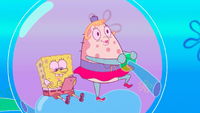 Mrs. Puff driving a bubble boat