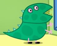 Wearing his dinosaur costume