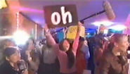 Look who's holding the "Oh" sign