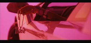Roman holding the Barbie Necklace