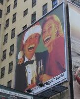 Cursed billboard featuring Donald Trump and a random woman celebrating Christmas.