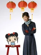 Kai-Lan is seen sitting next to the show's creator, Karen Chau