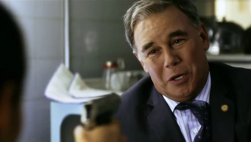 Nikita holds Jack at gunpoint