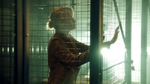 Kathleen Spencer in cage