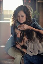 Carla comforting a young Nikita