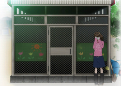Akane crying outside the hutch of dead rabbits.