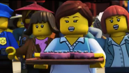 Ninjago citizens with a tray of cake in Season 9: Hunted.